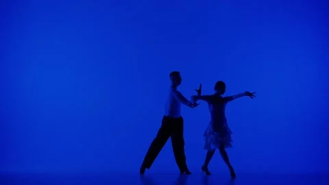 Elegant Ballroom Dance Couple on a blue background Stock Footage 258676341