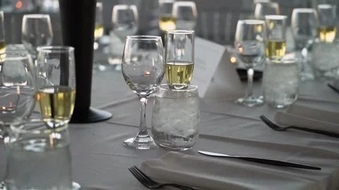 Elegant Banquet Table Setting with Wine Glasses and Beautiful Arrangement 스톡 동영상 290848462