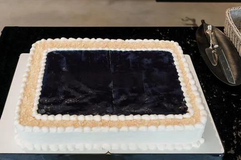 Elegant Black and White Rectangular Celebration Cake with Decorative Border Stock Photos