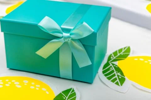 An elegant blue box with a bow hidden in the box money as a gift, a white t.. Stock-Fotos