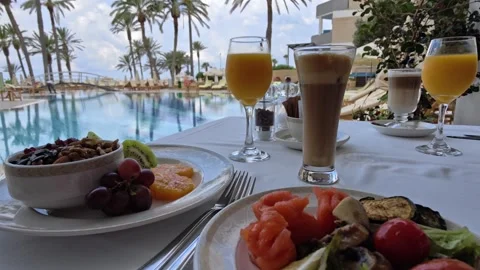 Elegant Breakfast Table Setting By The Pool At A Mediterranean Luxury Hotel Stock-Footage 342303882