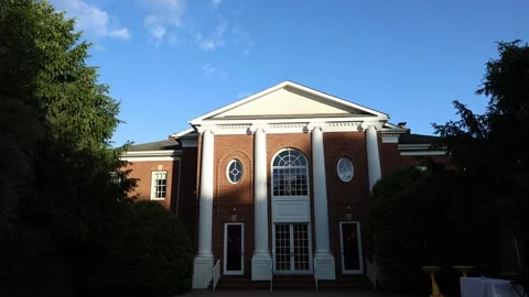 Elegant brick building with white columns Stock Footage 337795740