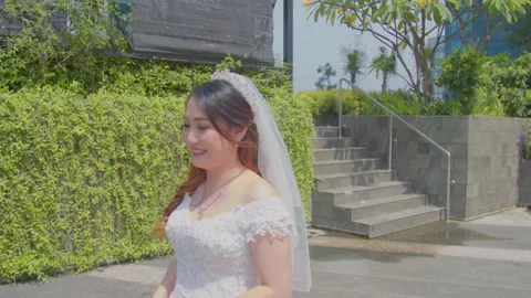 Elegant Bride Moving Gracefully in Long Wedding Gown Stock Footage 333378167