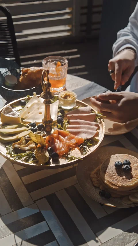 Elegant Brunch Table with Pastries and Colourful Food Spread Stock Footage 334602540