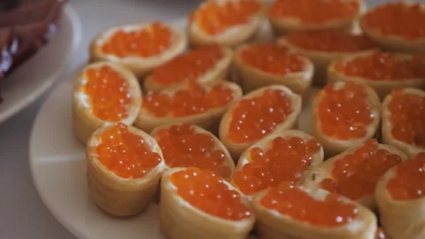 Elegant Buffet Spread Featuring Exquisite Red Caviar Tartlets at a Daytime Stock Footage 272182450