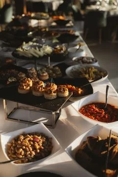 Elegant Buffet Table Setup with Assorted Appetizers Stock Photos