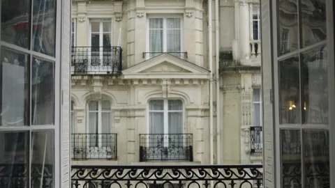 Elegant building facade seen through window with curtain Stock Footage 309298945