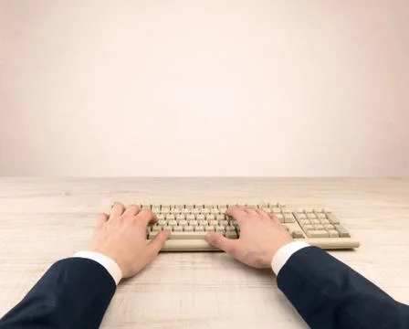 Elegant businessman hand typing on light background Stock Photos