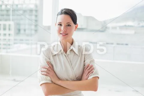 Elegant businesswoman standing inoffice Stock Photos