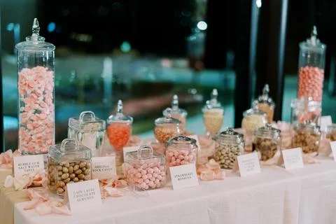 Elegant Candy Buffet Table with Glass Jars and Assorted Sweets Stock Photos