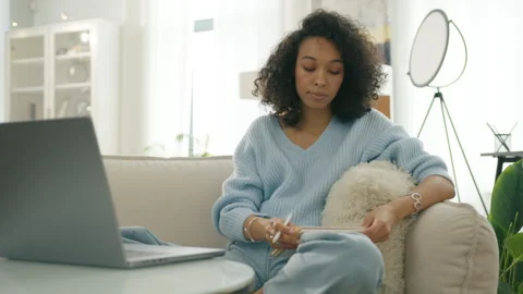 Elegant casual lady making notes in notebook, Curly female creative plot writer Vídeos de archivo 262380849