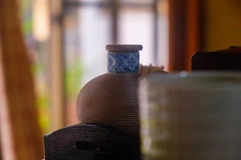 Elegant Ceramic Bottle with a Blue Pattern in a Cozy Interior Setting Stock Photos
