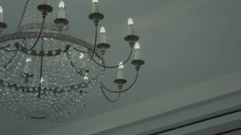 Elegant chandelier lighting in upscale interior space 스톡 동영상 217513694