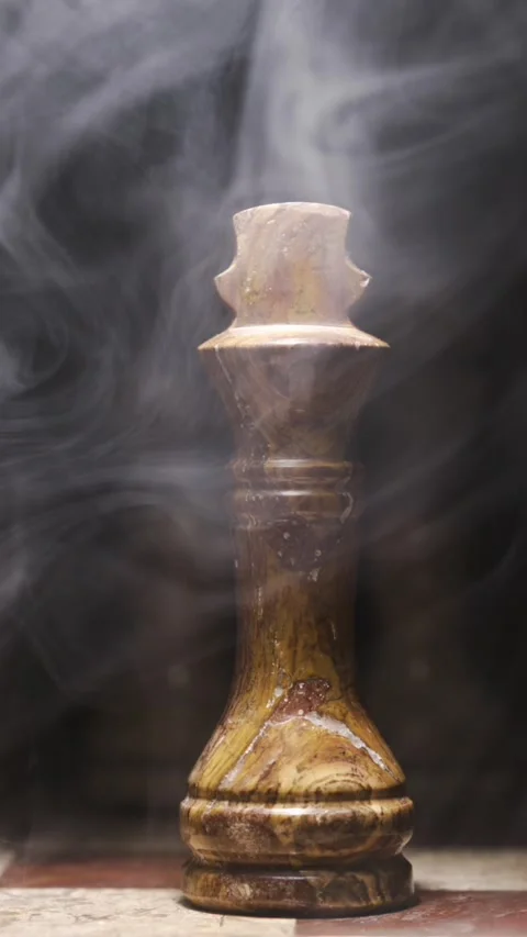 Elegant Chess Piece Surrounded by Dramatic Smoke on Dark Background Stock Footage 338142002