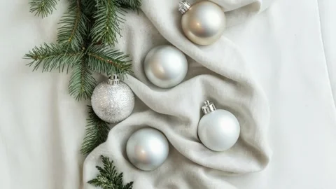 Elegant Christmas Decorations with Silver Baubles and Evergreen Sprigs Stock Footage 294508317