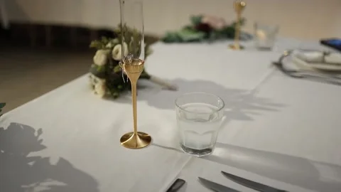 Elegant Close-Up of Wedding Table Setting With Champagne Glasses and Florals Stock Footage 340560693