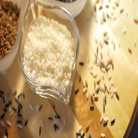 Elegant composition of three rice varieties in a glass bowl set Stock Footage 69705344