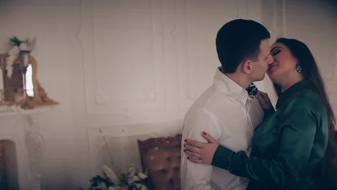 Elegant couple in a classic studio interior Видео 74138737