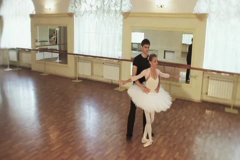 Elegant couple practicing ballet moves in studio, slow-motion Stock Footage 40287628