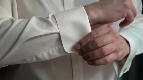 An Elegant Cufflink Attachment on a Formal White Shirt for Distinguished Stock Footage 314571747