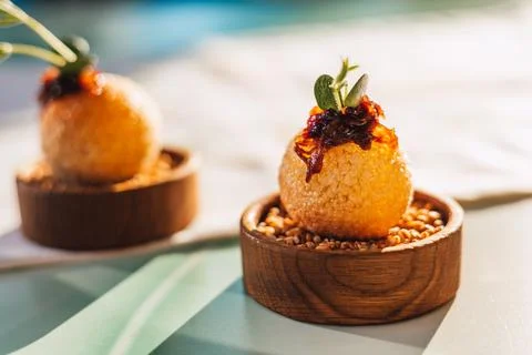 Elegant culinary presentation features appetizers with fresh herbs, artistic Stock Photos