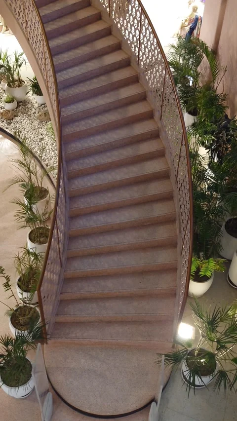 Elegant Curved Staircase, Decorative Railing &amp; Indoor Plants - Vertical Footage Stock Footage 342914092