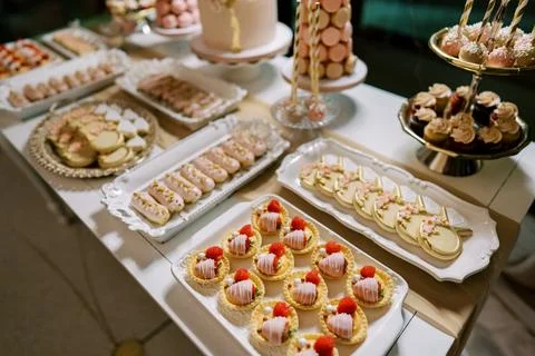Elegant Dessert Table with Assorted Pastries and Sweets Stockfoto's
