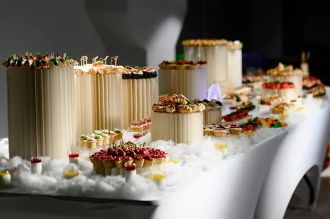 Elegant dessert table display with assorted pastries and decorative elements Stock Photos