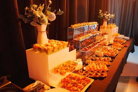 Elegant dessert table displaying assorted pastries and treats at an event Stock Photos