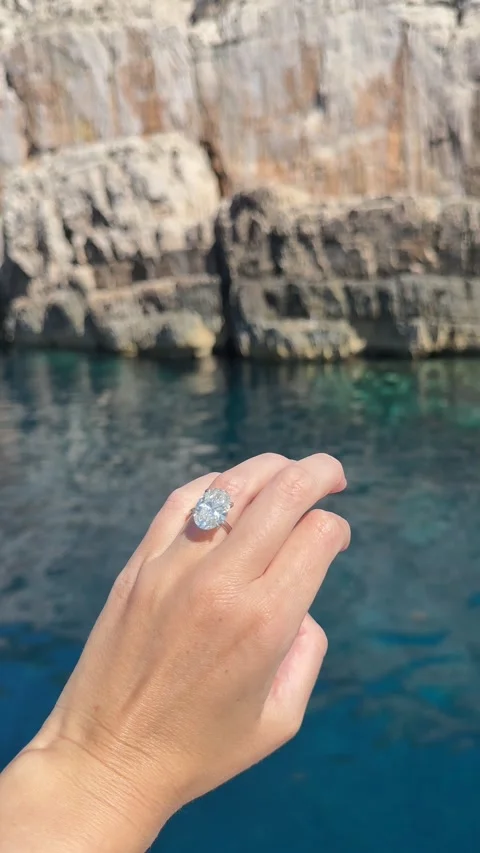 Elegant diamond ring captured in soft light by crystal clear Croatian water Stock Footage 318335025