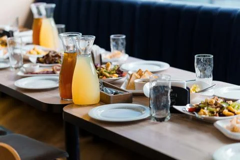 Elegant Dining Experience with a Plentiful Table Set for a Feast Stock Photos