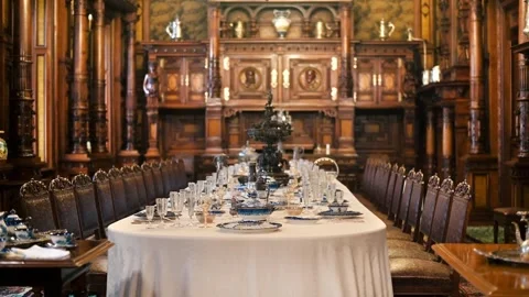Elegant dining room with long table set for a feast ready for guests. Stock Footage 339376442