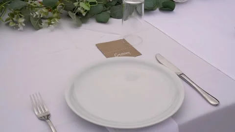 Elegant dining setup with floral decorations for a special event in a charming Stock Footage 320929678
