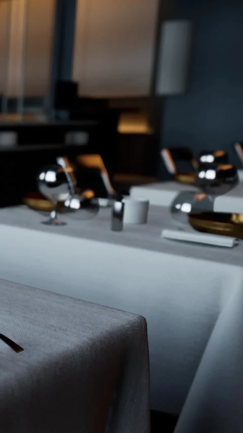 Elegant dining setup in a modern restaurant with table and glassware Stock Footage 337938695