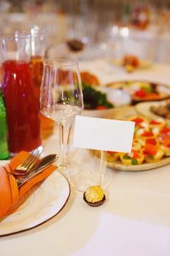 Elegant dining setup with refreshments and gourmet dishes at an event Stock Photos