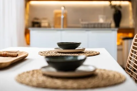Elegant dining setup with stylish dishware in a modern kitchen Stock Photos