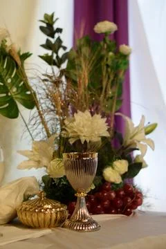 Elegant dining table set with an array of colorful fresh flowers Stock Photos