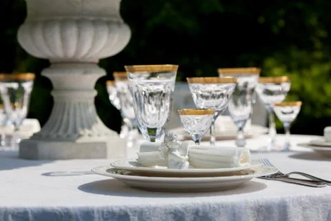An elegant dining table setting with napkin and win glasses Stock Photos