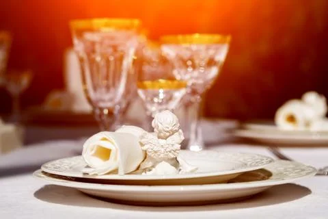 An elegant dining table setting with napkin and win glasses Stock Photos