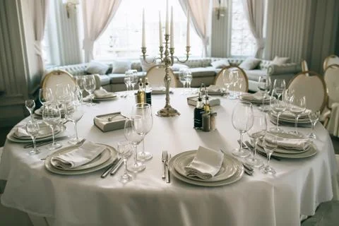 Elegant dining  table setting in the restaurant for the wedding dinner Stock Photos