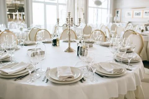 Elegant dining  table setting in the restaurant for the wedding dinner Stock Photos