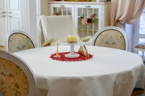 Elegant dining table setup with decorative elements in a bright room Stock Photos