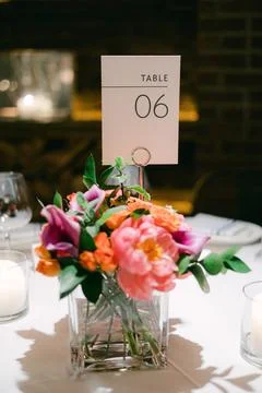 Elegant dining table setup with floral centerpiece at a cozy venue during an Stock Photos