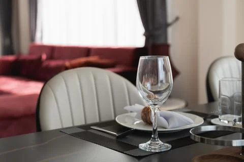 Elegant Dining Table Setup with Glassware and Tableware in Contemporary Int.. Stock Photos