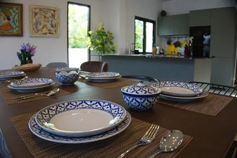 Elegant Dining Table with View of Modern Kitchen in Phuket, Thailand Stock Photos