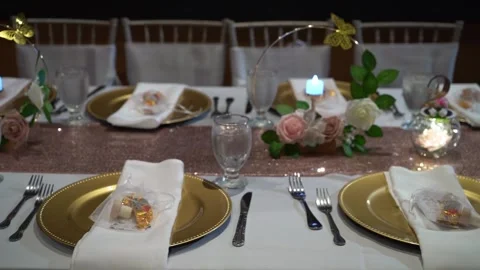 An Elegant Dinner Table Setup Artfully Decorated with Beautiful Floral Accents 스톡 동영상 290933583