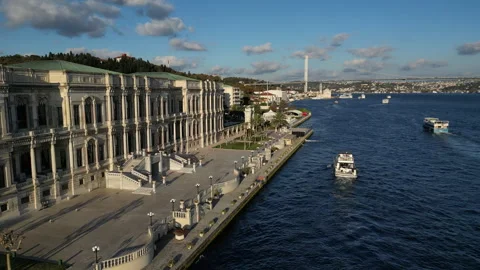 An elegant drone shot capturing Cırağan Palace's coastal 스톡 동영상 296287026