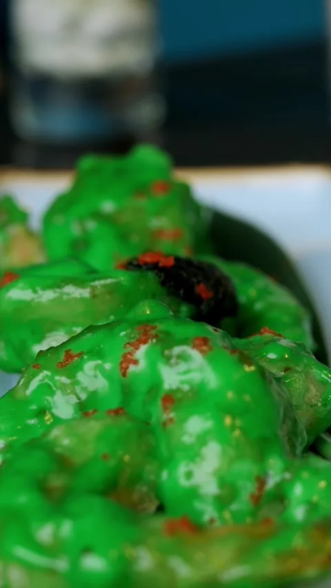 Elegant dumpling presentation. Smooth coated dumplings with vibrant red Video stock 344718034