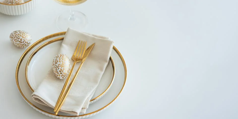 Elegant Easter Table Setting with Decorative Egg and Spring Details Stock Photos