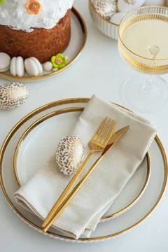 Elegant Easter Table Setting with Decorative Egg and Spring Details Stock Photos